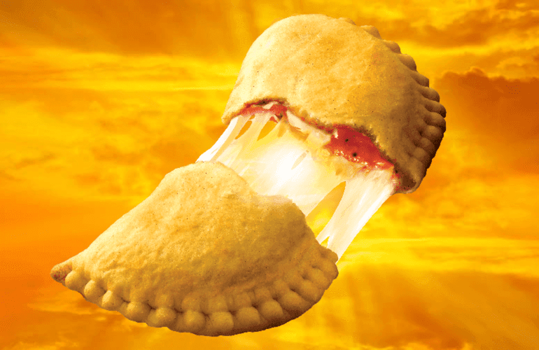 A halved pizza pop with the sun and clouds in the background